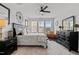 Main bedroom features neutral walls, black furniture, and lots of natural light at 1024 Traditions Ridge Dr, Wake Forest, NC 27587