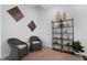 Cozy sitting area with comfortable chairs and stylish bookcase at 1024 Traditions Ridge Dr, Wake Forest, NC 27587