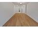 Bedroom with hardwood flooring and neutral walls, leading to walk in closet and bath at 10330 Sablewood Dr # 103, Raleigh, NC 27617