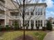 Exterior view of a home highlighting the many windows and landscaped grounds at 10330 Sablewood Dr # 103, Raleigh, NC 27617