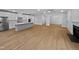 Spacious open floor plan connecting the living room, dining area, and a modern kitchen with stainless appliances at 10330 Sablewood Dr # 103, Raleigh, NC 27617