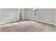 Carpeted bedroom with neutral walls offers a serene and inviting atmosphere with an adjacent closet at 104 Wilderness Ct, Mebane, NC 27302