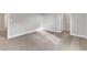 Neutral bedroom with plush carpet and adjacent closet offering ample space and potential at 104 Wilderness Ct, Mebane, NC 27302