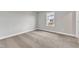 Light-filled bedroom with carpet, window view, and neutral walls at 104 Wilderness Ct, Mebane, NC 27302