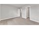 Neutral bedroom with plush carpet offering a closet and entry to another room at 104 Wilderness Ct, Mebane, NC 27302
