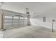 A spacious, clean garage with a modern automatic door and ample room for parking and storage at 104 Wilderness Ct, Mebane, NC 27302