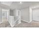 Hallway with a staircase and natural lighting at 104 Wilderness Ct, Mebane, NC 27302