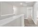 Hallway featuring a view of a doorway and neutral walls and carpet at 104 Wilderness Ct, Mebane, NC 27302