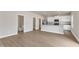 Modern kitchen with white cabinets, stainless steel appliances, and a nearby half bath at 104 Wilderness Ct, Mebane, NC 27302