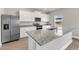 Bright kitchen features granite countertops, stainless appliances, and white cabinets at 104 Wilderness Ct, Mebane, NC 27302
