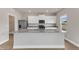 Bright kitchen features granite countertops, stainless appliances, and white cabinets at 104 Wilderness Ct, Mebane, NC 27302