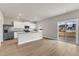 Open kitchen featuring stainless appliances, white cabinets, granite countertops and sliding door to patio at 104 Wilderness Ct, Mebane, NC 27302