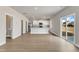 Open-concept kitchen featuring white cabinets, stainless appliances, and granite countertops at 104 Wilderness Ct, Mebane, NC 27302