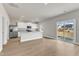 Modern kitchen with stainless steel appliances, granite countertops, and sliding glass door to backyard at 104 Wilderness Ct, Mebane, NC 27302