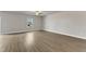 Bright living room with hardwood floors, a ceiling fan, and natural light from the window at 104 Wilderness Ct, Mebane, NC 27302