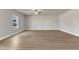 Bright living room with hardwood floors and natural light from the window at 104 Wilderness Ct, Mebane, NC 27302