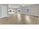 Open-concept living room and kitchen with hardwood floors and sliding glass doors at 104 Wilderness Ct, Mebane, NC 27302