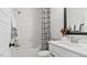 Bright bathroom with tub, white subway tile, modern fixtures, and stylish black and white shower curtain at 10620 Pleasant Branch Dr # 9, Raleigh, NC 27614