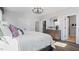 Bright bedroom featuring a modern ceiling fan, closet access, and ensuite bathroom at 10620 Pleasant Branch Dr # 9, Raleigh, NC 27614