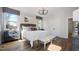 Cozy bedroom with a queen bed, natural lighting, and a dark chandelier offering simple elegance at 10620 Pleasant Branch Dr # 9, Raleigh, NC 27614