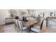 Open-concept dining room and kitchen with a large dining table and island seating at 10620 Pleasant Branch Dr # 9, Raleigh, NC 27614