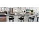 Bright kitchen featuring an island with bar stool seating and stainless steel appliances at 10620 Pleasant Branch Dr # 9, Raleigh, NC 27614