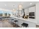 Modern kitchen with pendant lighting and island bar stool seating open to the dining area at 10620 Pleasant Branch Dr # 9, Raleigh, NC 27614