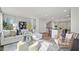 Bright, open-concept living room leading into the kitchen with stylish decor and natural light at 10620 Pleasant Branch Dr # 9, Raleigh, NC 27614
