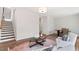 Cozy living area with stairs, stylish furnishings, hardwood floors, and an inviting atmosphere at 10620 Pleasant Branch Dr # 9, Raleigh, NC 27614