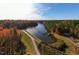Aerial view of wooded property featuring a long winding river, bright foliage, and natural beauty at 10622 Pleasant Branch Dr # 8, Raleigh, NC 27614
