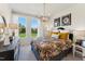 Bright bedroom featuring lots of natural light, a floral print bedspread, and dark wood furniture at 10622 Pleasant Branch Dr # 8, Raleigh, NC 27614