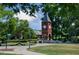 Quaint brick clock tower with manicured lawn, lush trees, and an idyllic setting at 10622 Pleasant Branch Dr # 8, Raleigh, NC 27614
