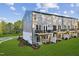 Beautiful rear view of the townhomes, with wooden decks and well-manicured lawns at 10622 Pleasant Branch Dr # 8, Raleigh, NC 27614