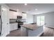 Kitchen featuring granite countertops, stainless steel appliances, and an island sink at 109 Wilderness Ct, Mebane, NC 27302