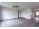 Spacious living room with vinyl floors, ceiling fan, and ample space for furniture at 109 Wilderness Ct, Mebane, NC 27302