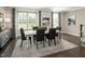 Elegant dining room with modern decor, featuring a sleek table, upholstered chairs, and stylish accents at 1210 Tannin Dr, Durham, NC 27713