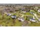 Aerial view of a neighborhood featuring well-maintained homes, green lawns, and mature trees at 123 Glasgow Dr, Clayton, NC 27520