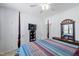Bright bedroom featuring a four poster bed, TV, and light walls at 123 Glasgow Dr, Clayton, NC 27520