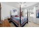 Cozy bedroom with ceiling fan, four poster bed, and bright light from window at 123 Glasgow Dr, Clayton, NC 27520