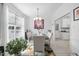 Bright dining room featuring a modern chandelier and view into kitchen at 123 Glasgow Dr, Clayton, NC 27520