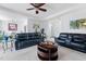 Comfortable living room featuring plush leather sofas, neutral carpet, and an inviting atmosphere at 123 Glasgow Dr, Clayton, NC 27520