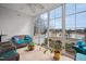 Bright sunroom with wicker furniture and large windows overlooking the lake at 123 Glasgow Dr, Clayton, NC 27520