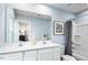 Bright bathroom with double vanity, large mirror, and shower-tub combination at 133 Cavalier Rider Run, Wendell, NC 27591