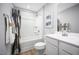 Bright bathroom featuring a vanity, framed mirror, and a shower and tub combo at 133 Cavalier Rider Run, Wendell, NC 27591