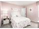 Cute bedroom featuring pink walls, ballerina-themed artwork, and a comfortable bed, creating a delightful space at 133 Cavalier Rider Run, Wendell, NC 27591