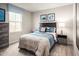 Comfortable bedroom featuring neutral walls, stylish penguin-themed artwork, and coordinated furnishings creating a delightful space at 133 Cavalier Rider Run, Wendell, NC 27591
