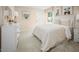 Comfortable bedroom featuring neutral paint and decor, a queen bed, and a bright window at 133 Cavalier Rider Run, Wendell, NC 27591
