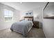 Well-lit bedroom with a plush carpet, a queen bed, and natural light from a window at 133 Cavalier Rider Run, Wendell, NC 27591