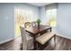 Cozy dining area with modern table setting and a sliding glass door for natural light at 133 Cavalier Rider Run, Wendell, NC 27591