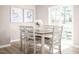 Dining room with a wooden table, six chairs, and sliding glass doors to the patio at 133 Cavalier Rider Run, Wendell, NC 27591